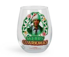 a wine glass with a christmas card on it's front and the words merry glarrkmas