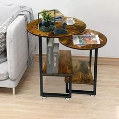 two tables sitting next to each other on top of a hard wood floored floor