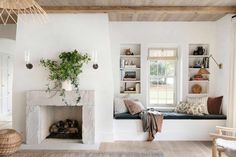 a living room filled with furniture and a fire place