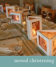 the table is set with place settings for four people to sit at and have pictures on them