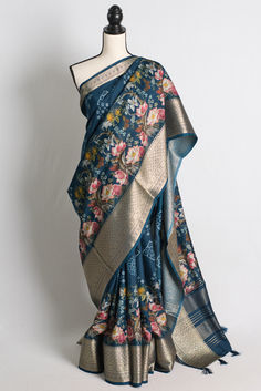 Blended Silk Printed Saree in Blue and Metallic Gold Festive Blue Floral Print Dupatta, Bollywood Style Blue Floral Saree, Blue Chanderi Saree With Printed Motifs, Blue Art Silk Saree With Printed Motifs, Blue Floral Print Saree With Traditional Drape, Blue Floral Print Saree For Festivals, Blue Floral Print Saree For Diwali, Diwali Blue Floral Print Saree, Traditional Blue Saree With Floral Print