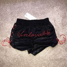 These Sexy Black Velvet Shorts Have A Red Lace-Up Design On Both Sides. The Back Of The Shorts Have “Unlovable” Written In Red Font To Perfectly Match The Red Lace Design. Super Soft Material And Stretches Well. Never Worn And Brand New With Tag. Trendy Red Shorts For Night Out, Red Ruffled Shorts, Red Streetwear Bottoms With Built-in Shorts, Red Cotton Bottoms With Built-in Shorts, Red Basketball Shorts, Red Cotton Playwear Shorts, Black Velvet Shorts, Lululemon Hotty Hot Shorts, Womens Athletic Shorts