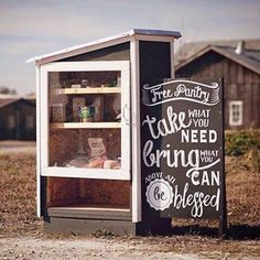 an old fashioned ice cream kiosk with chalk writing on it