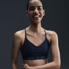 Don't let anything get in the way of expressing yourself in this sleek, low-profile sports bra. Its light support gives you a gentle hold with plenty of freedom that's great for low-impact workouts or all-day comfort. Smooth, quick-drying fabric gives the bra a clean finish so you can wear it your way. Nike Bras, Nike Sports Bras, Air Bra, Nike Clothes, Nike Bra, Expressing Yourself, All Black Shoes, Short Tank Top, Half Zip Jacket