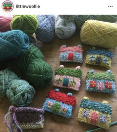 several balls of yarn sitting on top of a wooden table