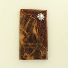 a brown and tan leather wallet with a silver buckle on it's side,