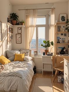 a bedroom with a bed, desk and shelves on the wall next to a window