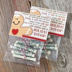 two packages of holiday doughnuts sitting on top of a wooden table