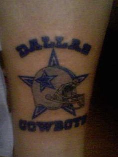 a tattoo on the leg of a person with a football helmet and star in it