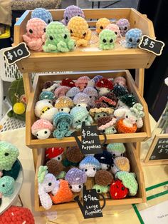 there are many small crocheted animals on display in the store, and one is for sale