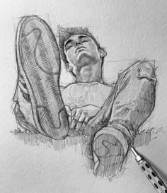 a pencil drawing of a man laying on the ground with his feet up next to him