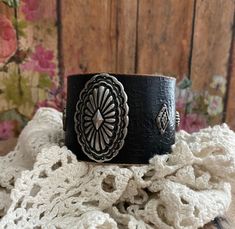 "v'¯) .`*.¸.*'  Beautiful RuStiC Wide leather bracelet, with a FeMiNinE flair  ❤  This DESIGN ❤~ Handmade leather cuff, hammered, painted black and distressed. This wide black leather cuff holds a beautifully detailed oval silver concho. Small silver rivets compliment the center piece. The width of the cuff is approximately 1 3/4\" wide. BRACELET SIZING INFO: My women's bracelets are approximately 8 1/2 inches end to end. I place 2 snaps at 7 and 7 3/4 inches for adjustability. jewelry for your Vintage Black Bracelet For Festival, Adjustable Concho Cuff Bracelet Gift, Black Cuff Leather Bracelet For Festivals, Black Leather Cuff Bracelet For Festivals, Bohemian Black Cuff Bracelet, Vintage Black Cuff Bracelet As Gift, Wide Cuff Bracelets, Leather Wristbands, Women's Bracelets