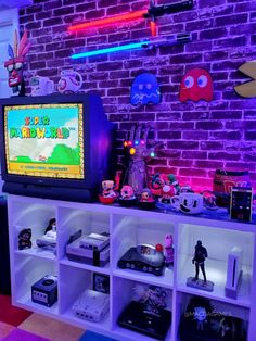 an entertainment center with various video games on shelves and neon lights in the back ground