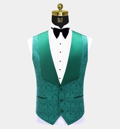 This men's three-piece green damask tuxedo is sure to get you noticed at your next formal affair. This fancy outfit is finely handcrafted from a high-quality material with a delicately textured damask design. This elegant tuxedo set comes with a patterned blazer, a matching vest, and dress pants. The contrasting peak collar, buttons, and pocket piping all provide added class and interest to this set. The lightweight fabric is soft and comfortable as well as stain-resistant. The vest/waistcoat ha Green Tuxedo Style Three-piece Suit For Wedding, Green Fitted Elegant Sets, Elegant Green Suit And Tie Accessories For Groom, Elegant Brocade Tuxedo For Wedding, Fitted Green Three-piece Suit For Groom, Luxury Brocade Suit For Formal Occasions, Green Fitted Three-piece Suit For Groom, Fitted Green Three-piece Suit For Grooms, Tailored Green Three-piece Suit For Groom