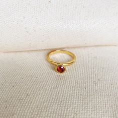 Final Sale. Gorgeous unique solitaire ring to wear itself or as stackable. Combine cubic zirconia colors and gold color, as is offered in rose gold and yellow gold. * Metal: 18k Gold filled 1/20 * High-quality zirconia * Hypoallergenic Jewelry * Water-resistant * Handcrafted in Brazil Learn how to care for your jewelry with these easy instructions. Properly handling and caring for your ArtBossa jewelry is essential in maintaining its pristine condition. 1. Keep your gold-filled jewelry away from chemicals and cleaning products. Remove your jewelry when handling them to keep it in good condition. 2. To protect your jewelry, don't apply perfume directly on it. Apply fragrance to your body first and wait a few minutes before putting on jewelry. Alcohol in perfume can damage your precious piec Gold Stackable Rings With Birthstone In Cubic Zirconia, Stackable Yellow Gold Rings With Cubic Zirconia And Birthstone, Gold Solitaire Stackable Rings As A Gift, Yellow Gold Stackable Rings With Birthstones, Gold Ruby Solitaire Ring, Minimalist Gold Solitaire Ruby Ring, Gold Ruby Ring With Solitaire Round Cut, Minimalist Gold Ruby Ring With Bezel Setting, Gold Ruby Round Cut Promise Ring