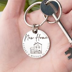 a person holding a key to their new home