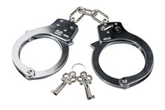 two metal handcuffs with keys attached to them