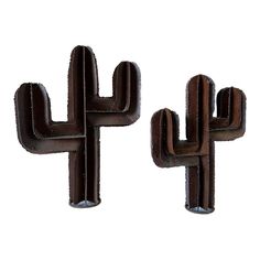 two brown metal cactus sculptures sitting next to each other