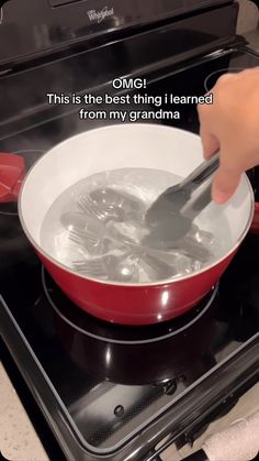 someone is stirring something in a pan on the stove