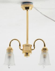 two light fixtures hanging from a ceiling fixture