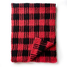 a red and black checkered scarf on a white background with a fringe in the middle