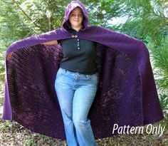 a woman wearing a purple shawl is posing for the camera with her hands on her hips