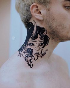 a man with a tattoo on his neck