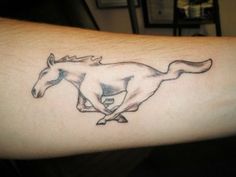 a horse is depicted on the arm of a person with a tattoo that has been drawn onto it