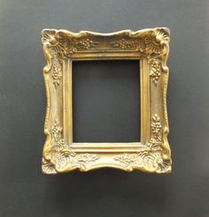 an ornate gold frame on a black background