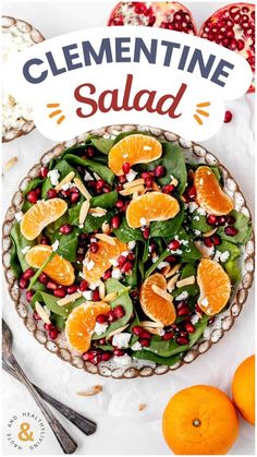 a salad with oranges, spinach and feta cheese on top in a bowl