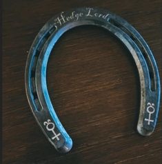 an old horseshoe with the word hope lord written on it sitting on a wooden table