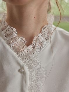 Color
White


Detail
Lace collar and placket; Two layers of openwork lace; Pearl buttons



Composition

100% Polyester



Washing Method

Hand wash in cool water, using a mild and gentle detergent. Lace Button-up Blouse With Lace Cuffs, Long Sleeve Blouse With Lace Collar For Layering, Elegant Lace Blouse With Ruffles, Elegant Ruffled Lace Blouse, Elegant Blouse With Peter Pan Collar And Buttons, Feminine Lace Top Blouse For Layering, Elegant Tops With Lace Collar For Layering, Lace Blouse With Buttons For Daywear, Elegant White Blouse For Layering