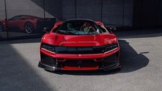 a red sports car parked in front of a building