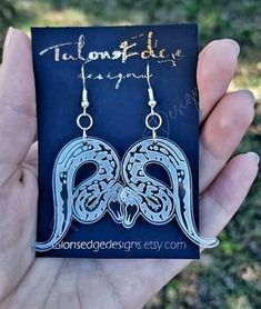 "Make a statement with these unique ball python earrings! They are precision laser etched and cut from high quality 1/8\" clear acrylic. The earrings are not heavy, and they will not weigh down your ears. The hooks are made of sterling silver and are hypoallergenic and nickel free. 1.57\" H x 1.43\" W, not including the hook and rings hardware." Acrylic Earring, Ball Python, Snake Earrings, Laser Etching, Drop Earring, Acrylic Earrings, Python, Clear Acrylic, Dog Tag Necklace