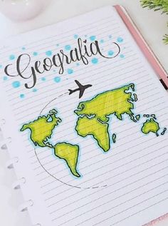 an open notebook with the word geographia written on it and a world map