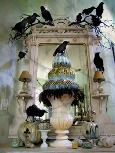 there are many black birds sitting on top of the vases in front of the mirror