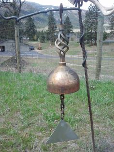 an old fashioned wind chime in the grass