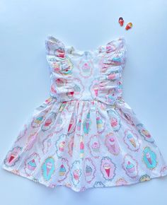 "The perfect cotton dress for girl. It is made of natural cotton, with ice cream print. The ruffles sewed with white cotton lace. Size information: age 0-3 months / height 22,05 \"- 22,83 '' (58-62 cm) / chest 17,72 '' (45 cm) age 3-6 months / height 26,77 '' (68 cm) / chest 19,29 '' (49 cm) age 6-9 months / height 29,13 '' (74 cm) / chest 20,08 '' (51 cm) age 9-12 months / height 31,5 '' (80 cm) / chest 20,87 '' (53 cm) age 12-18 months / height 33,86 '' (86 cm) / chest 21,86 '' (55 cm) age 2T Sweet Ruffle Dress For Garden Party, Sweet Ruffled Dress For Garden Party, Cotton Sundress For Babies For Beach, Cute Ruffled Dress For Birthday, Short Sleeve Ruffle Dress For Birthday, Short Sleeve Ruffled Birthday Dress, Cute Ruffle Hem Dress For The Beach, Cute Ruffle Hem Dress For Beach, Cute Ruffle Dress With Ruffle Hem For Beach