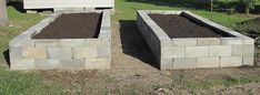 two cinder blocks sitting in the middle of a yard