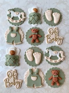 baby shower cookies are arranged on a table