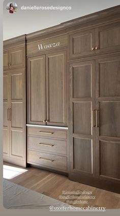 a kitchen with wooden cabinets and drawers