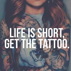 a woman with tattoos on her arms and chest is looking at the camera while she's saying life is short, get the tattoo