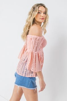 A solid lace top featuring off shoulder neckline, angel sleeve, and smocked bodice with peplum Details Self: 60% Cotton, 40% Nylon Lining: 100% Polyester Size & Fit - Model is 5`8" And Wearing Size Small - Measurements Taken From Size Small - Approx. Length: 18" Feminine Lace Top For Brunch, Chic Strapless Lace Tops, Chic Strapless Top With Lace Trim, Chic Lace Bodice Top For Spring, Feminine Crochet Top For Spring Party, Spring Off-shoulder Lace Blouse, Off-shoulder Lace Top Blouse For Spring, Off-shoulder Lace Top For Spring, Off-shoulder Lace Blouse For Spring