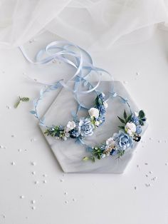 two blue and white flower crowns on a hexagonal plate