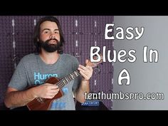 a man playing an ukulele with the words easy blues in a box