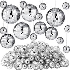 a bunch of shiny disco balls hanging from strings