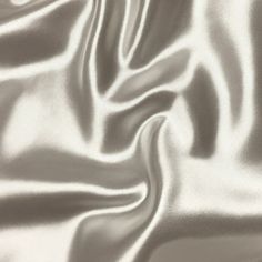 The bridal satin is a luxurious satin fabric. It is 60" wide, 160GSM, and 100% polyester. Known for its silky smooth touch and radiant colors, this high quality satin is ideal for: -glamorous gowns -bridal wear -bridesmaid dress -cocktail dresses -blouses and many other forms of apparel! The bridal satin has a sturdy body and a soft drape which makes it great for curtains, drapes, table sashes and other event decor. It is your go to fabric for a medium-heavy drape that shines and shimmers. Large Heavy Wedding Dress, Glamorous Gowns, Dress Cocktail, Fabric Shop, Blouse Dress, Bridal Wear, Cocktail Dresses, Sewing Fabric, Satin Fabric