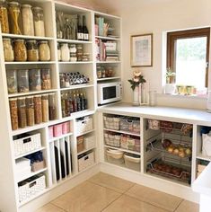 an organized pantry with lots of items in it