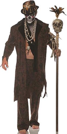 a man dressed up as a skeleton holding a stick