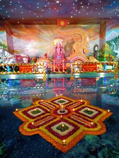 an elaborately decorated stage with lights and decorations on the floor in front of it